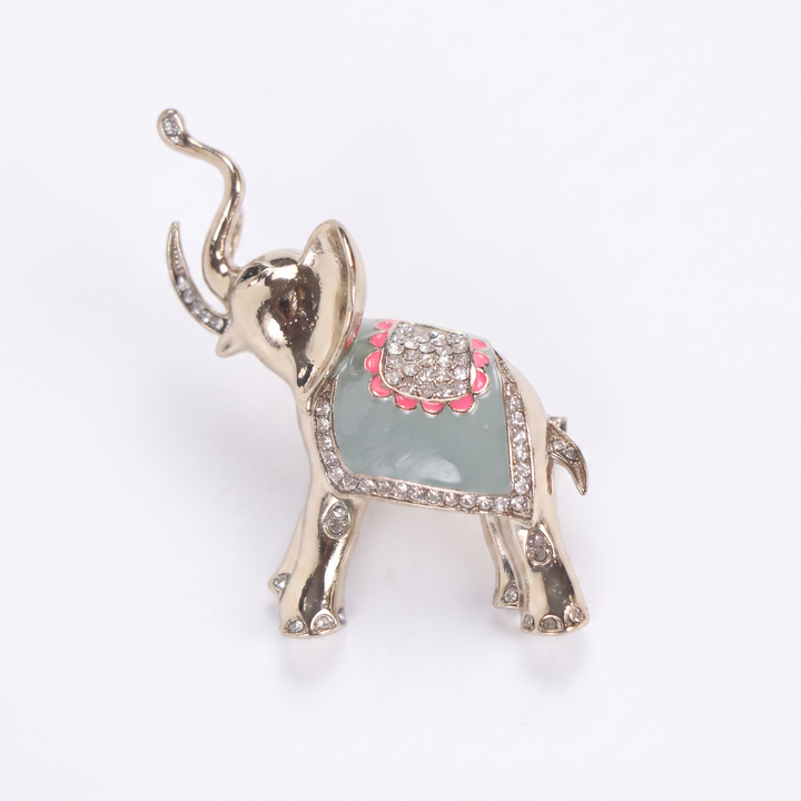 Polished gold-tone trunk-up elephant brooch pin with sage green enamel and clear crystal saddle 