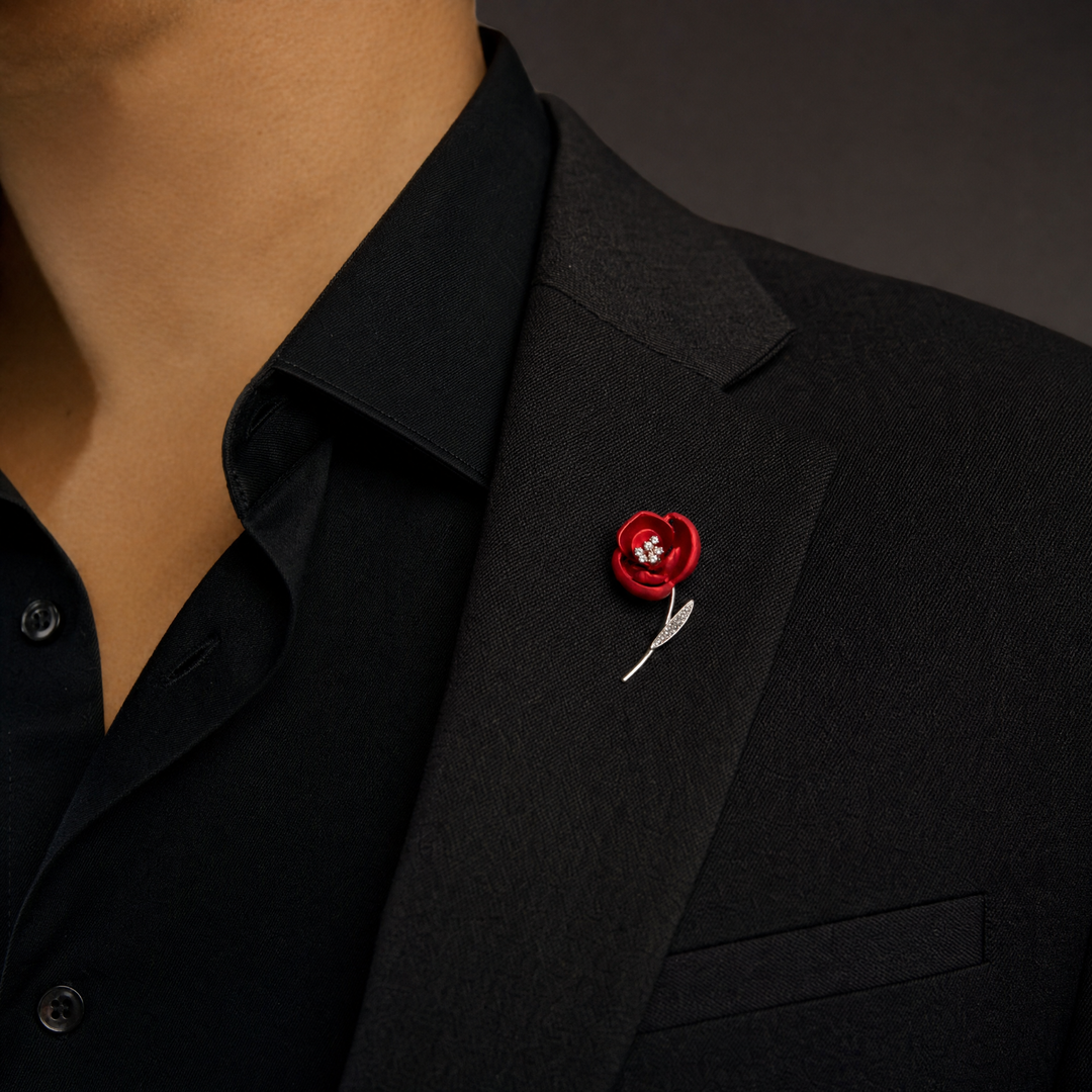 Matte red flower brooch pin with crystal stamen and crystal leaf on a rose gold 