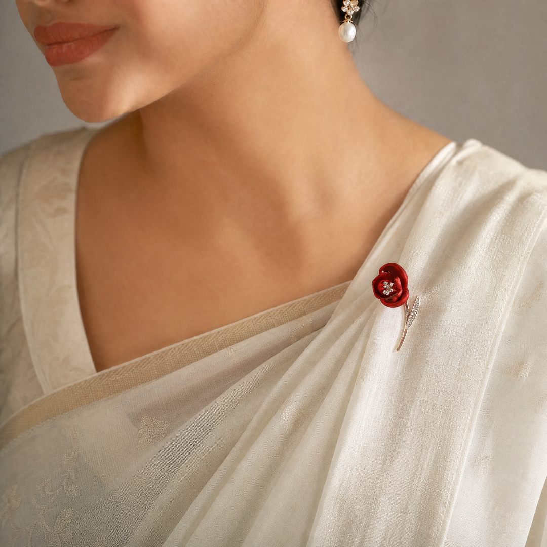 Matte red flower brooch pin with crystal stamen and crystal leaf on a rose gold 