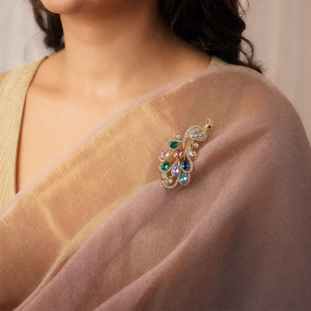 Sparkling gold peacock brooch pin adorned with colorful teardrop-cut crystals and clear pavé rhinestones