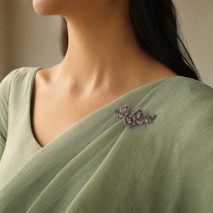 Silver-tone orchid branch brooch pin pavé-set with purple and pink crystals with emerald green crystal stems