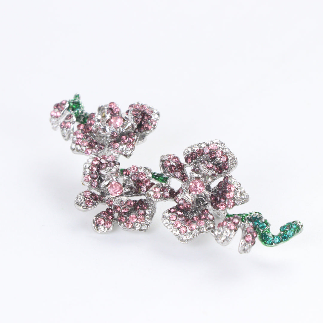 Silver-tone orchid branch brooch pin pavé-set with purple and pink crystals with emerald green crystal stems