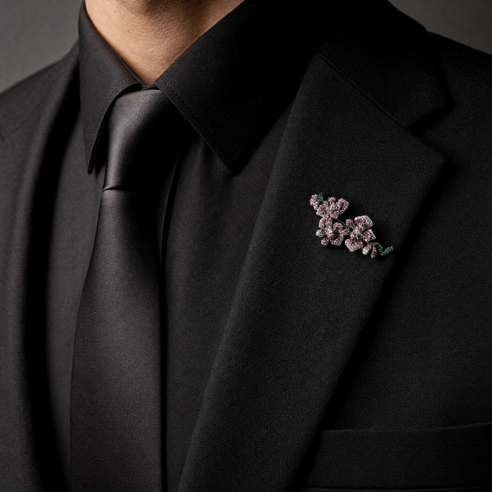 Silver-tone orchid branch brooch pin pavé-set with purple and pink crystals with emerald green crystal stems