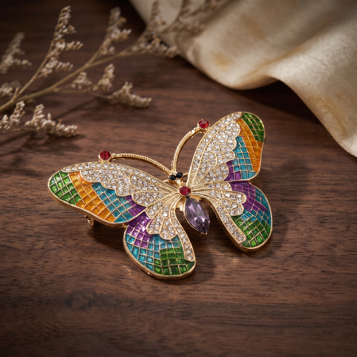 Colorful stained-glass style butterfly brooch pin with clear crystals and a purple marquise center stone