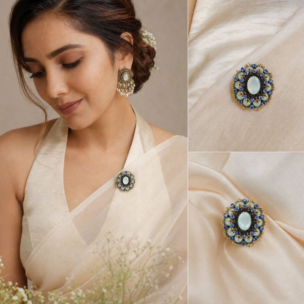 Ornate antique gold-tone round medallion brooch pin featuring a mint green cabochon center and sapphire blue crystal 