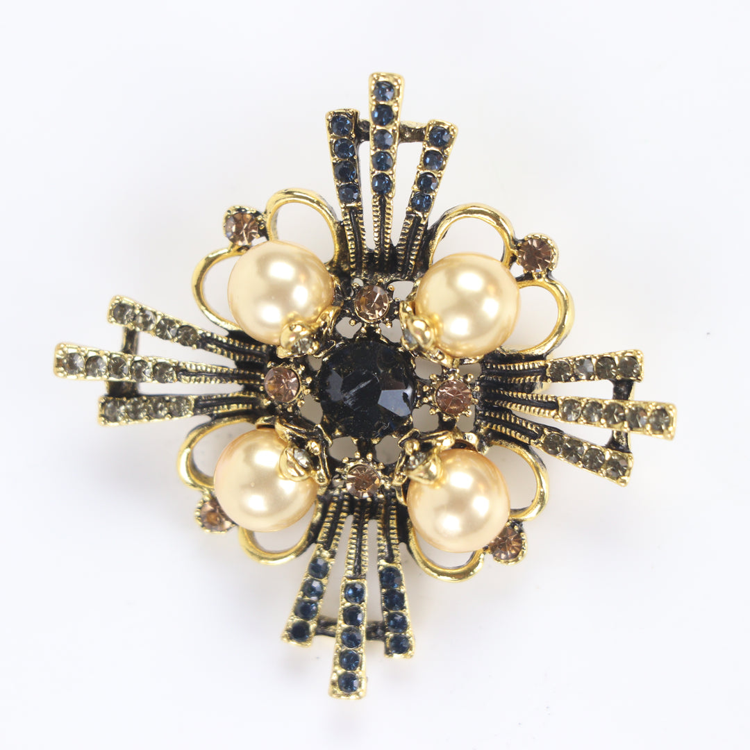 Vintage antique gold baroque cross brooch pin set with four pearl cabochons and multi-colored crystals on a white background by Delemon