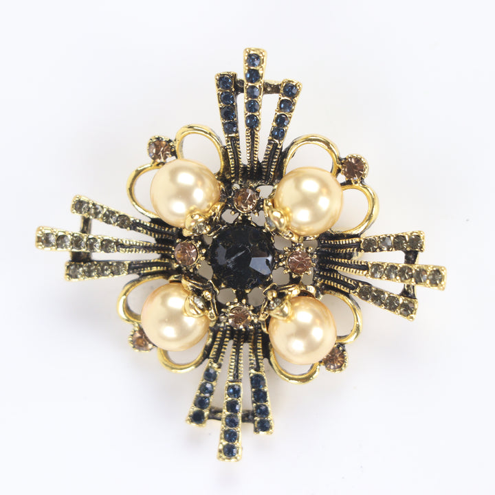 Vintage antique gold baroque cross brooch pin set with four pearl cabochons and multi-colored crystals on a white background by Delemon