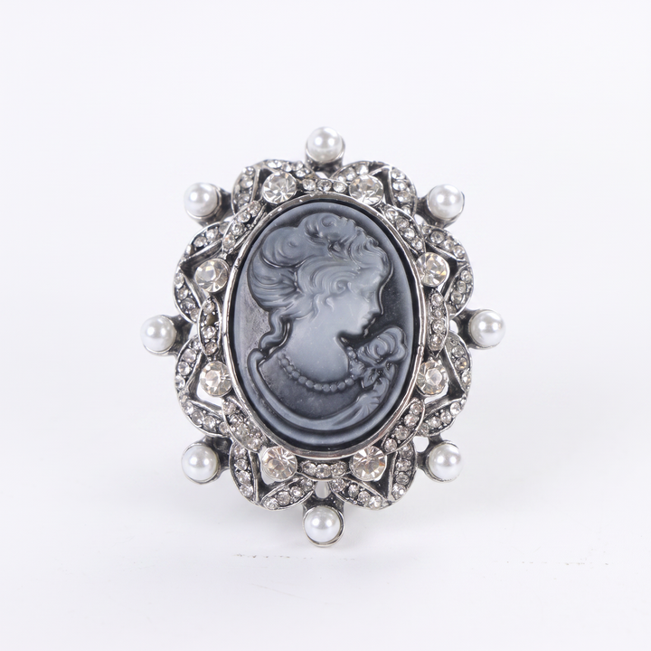 Antique silver-tone oval cameo brooch pin featuring a carved lady profile, clear rhinestones, and pearl 