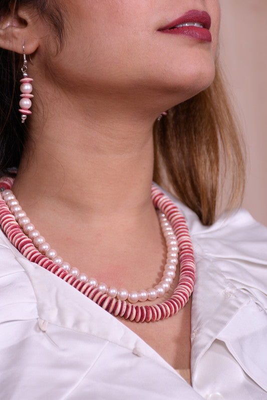 Bone Bead Necklace Styled With a Layer of Pearl